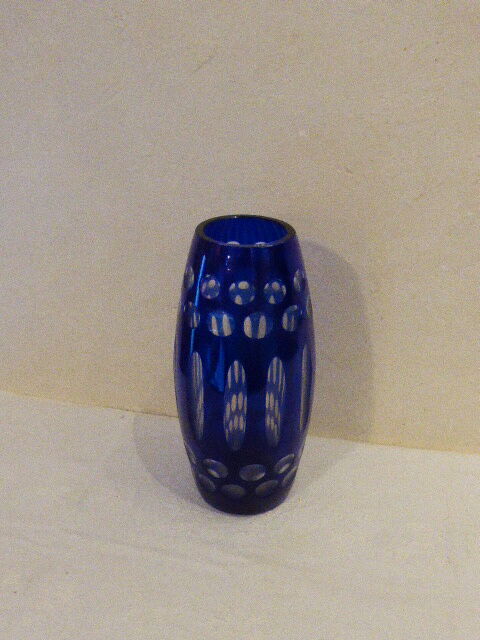 Blue and transparent glass vase, has vintage geometry patterns