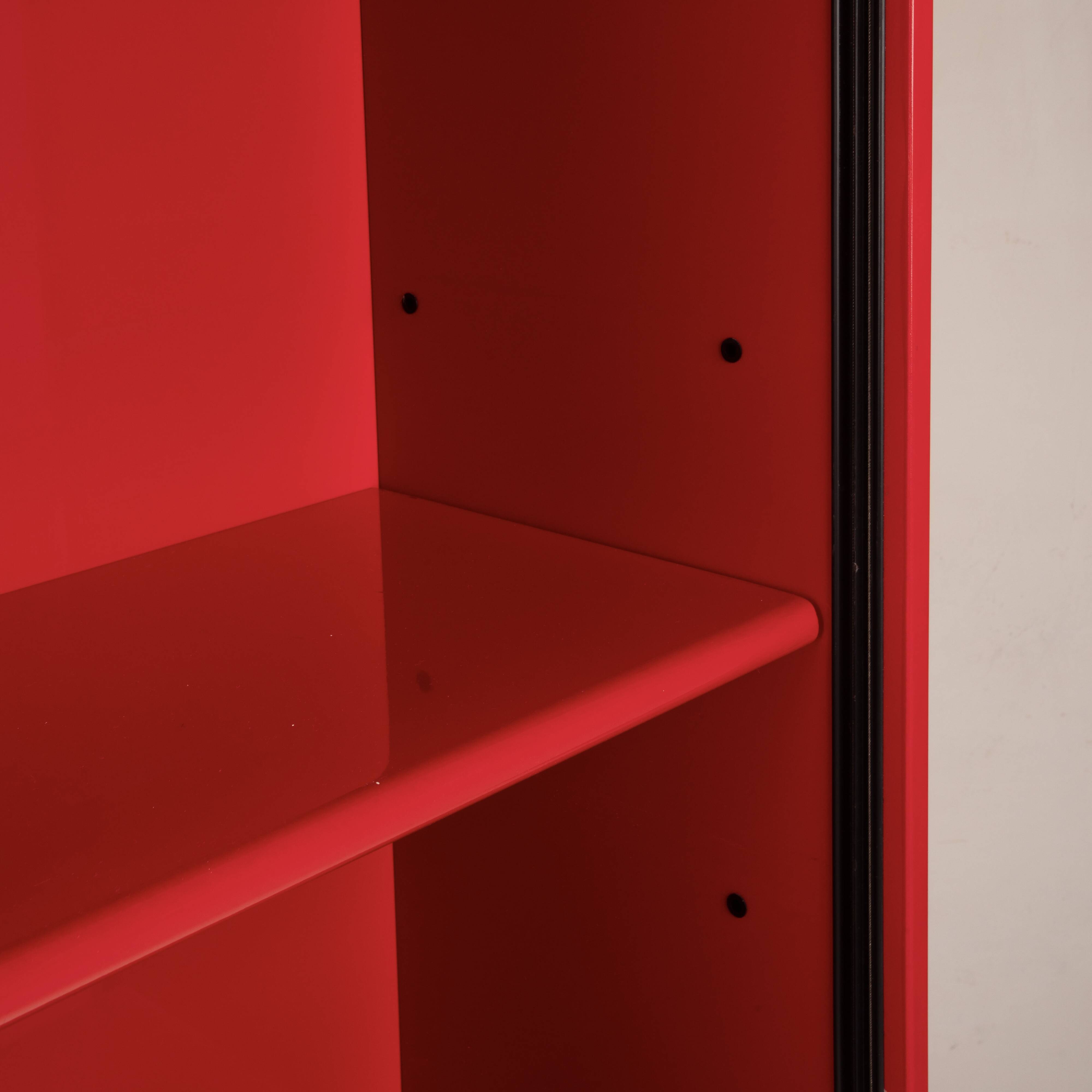 Double-face rotating display cabinet in red lacquer by Arflex, 1980s