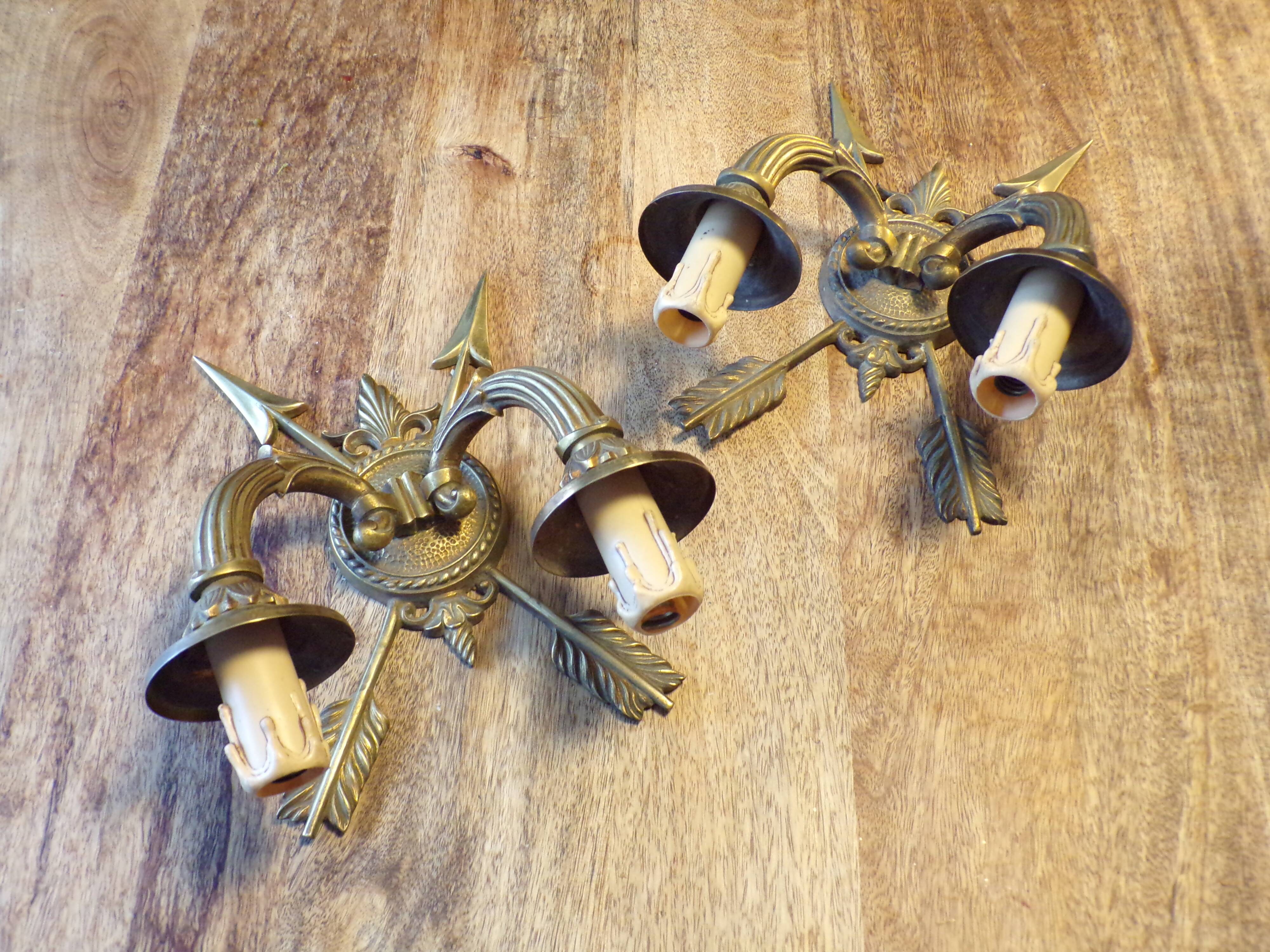 Pair of empire style bronze arrow wall lights