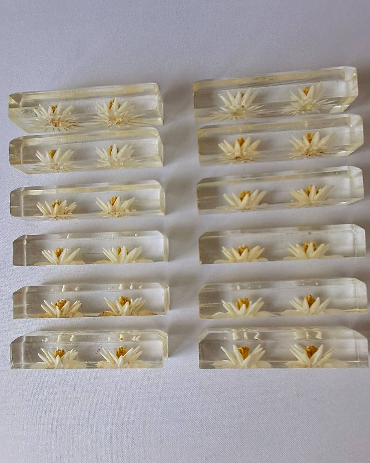12 knife rests with resin inclusion. 1970s.