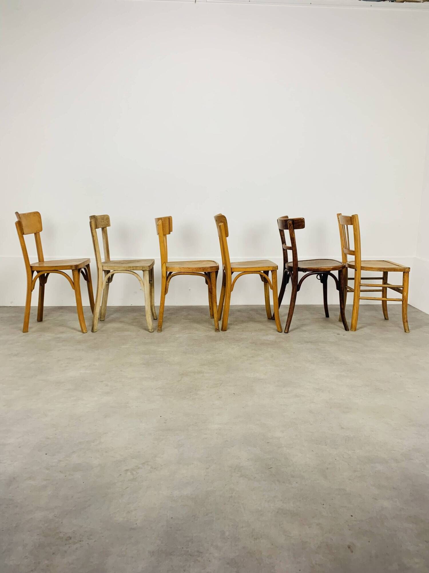 6 mismatched Baumann & Luterma bistro chairs, wood, 1960s