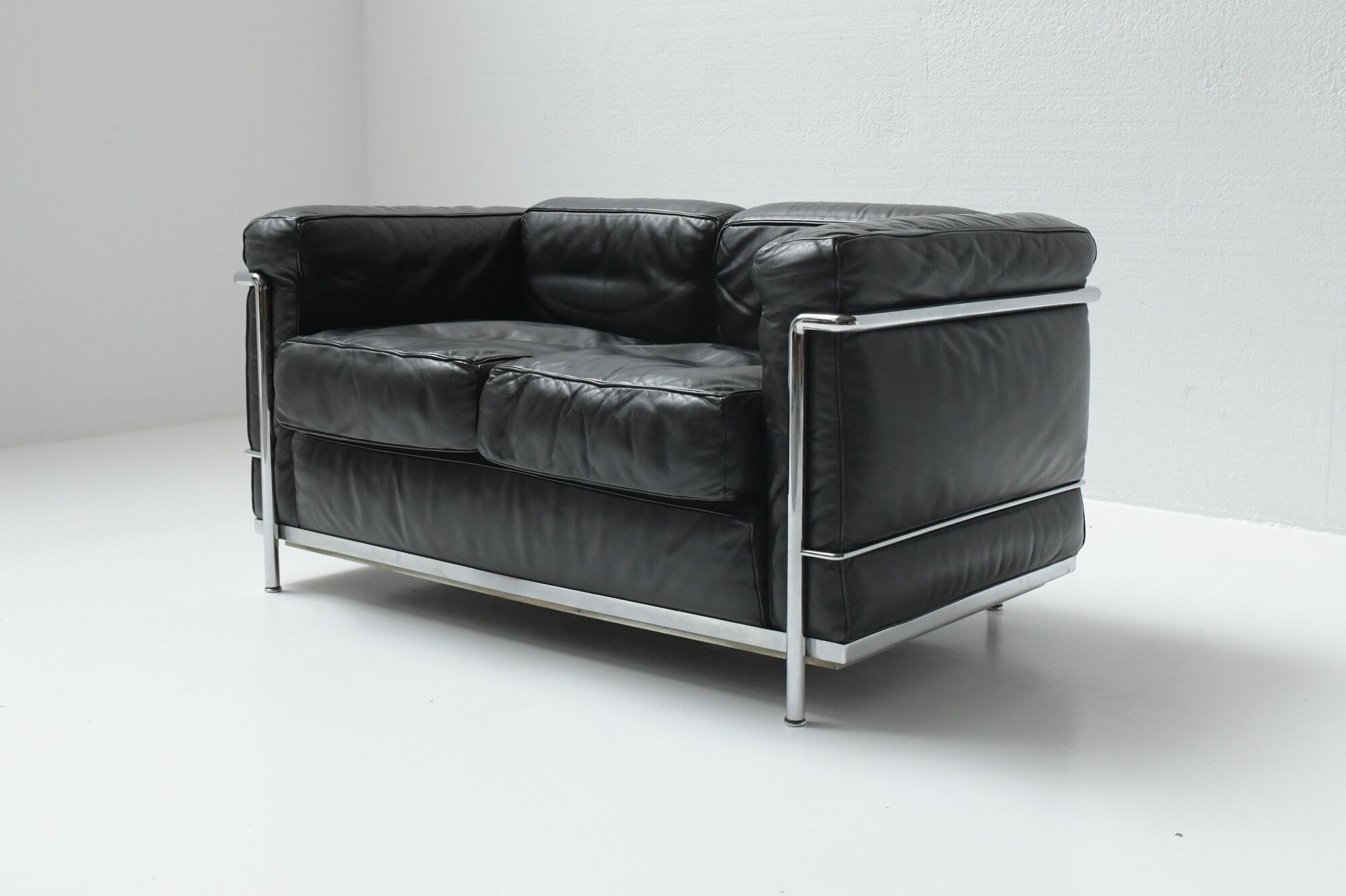 Vintage LC-2 in black leather by Le Corbusier, Jeanneret & Perriand for Cassina