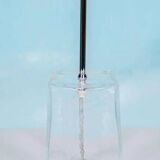 Minimalist glass table lamp from the 80s with a pleated shade.