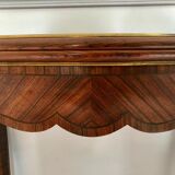 Console transforming into a 19th century Louis XV style gaming table