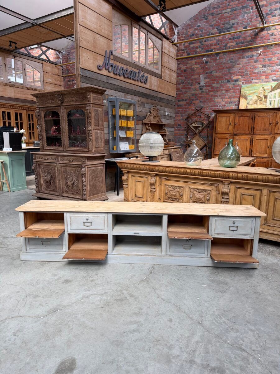 Old workshop furniture transformed into a TV unit.