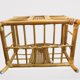 Wicker rattan magazine rack with vintage caning