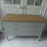 Green green vintage chest of drawers of gray, wood top.