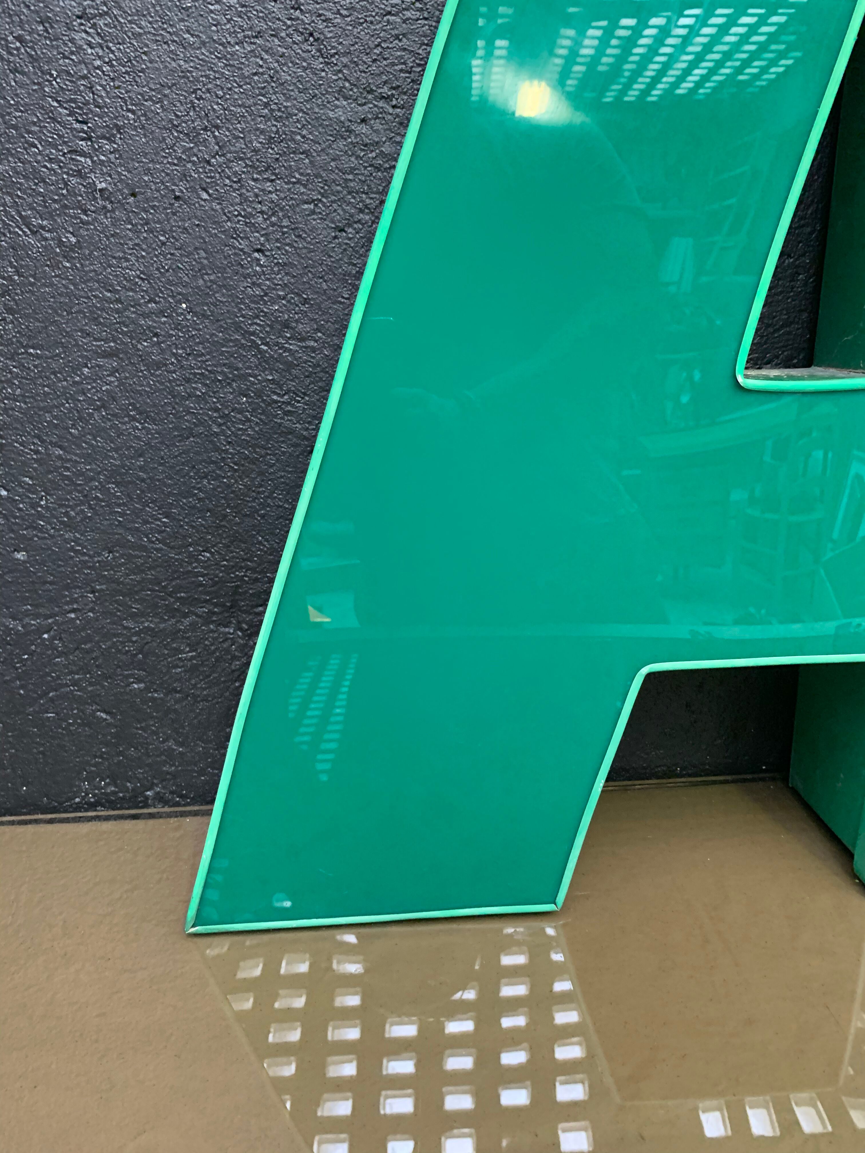 Old letter in metal and plexiglass, industrial decoration