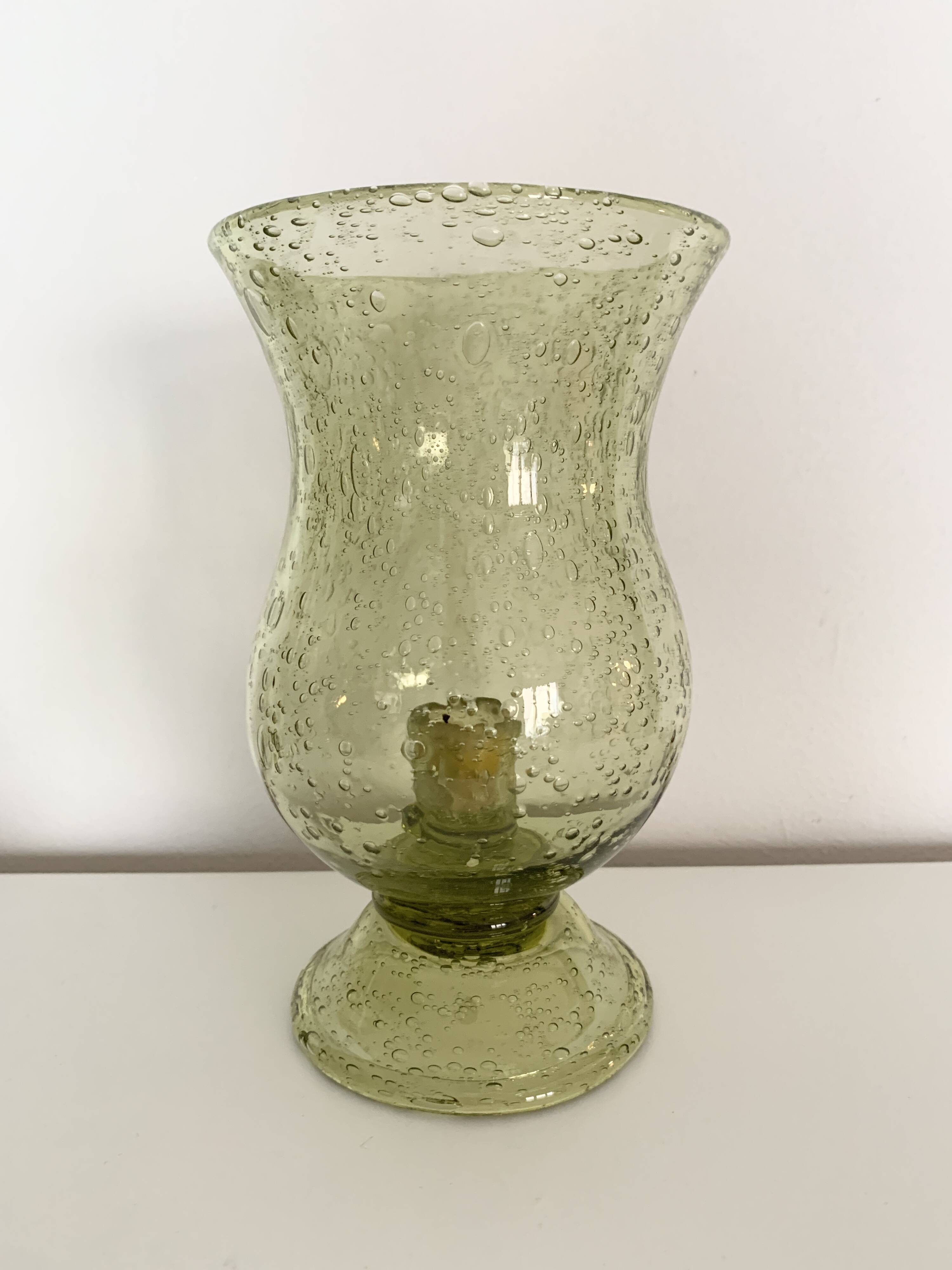 Important green bubbled glass candlestick