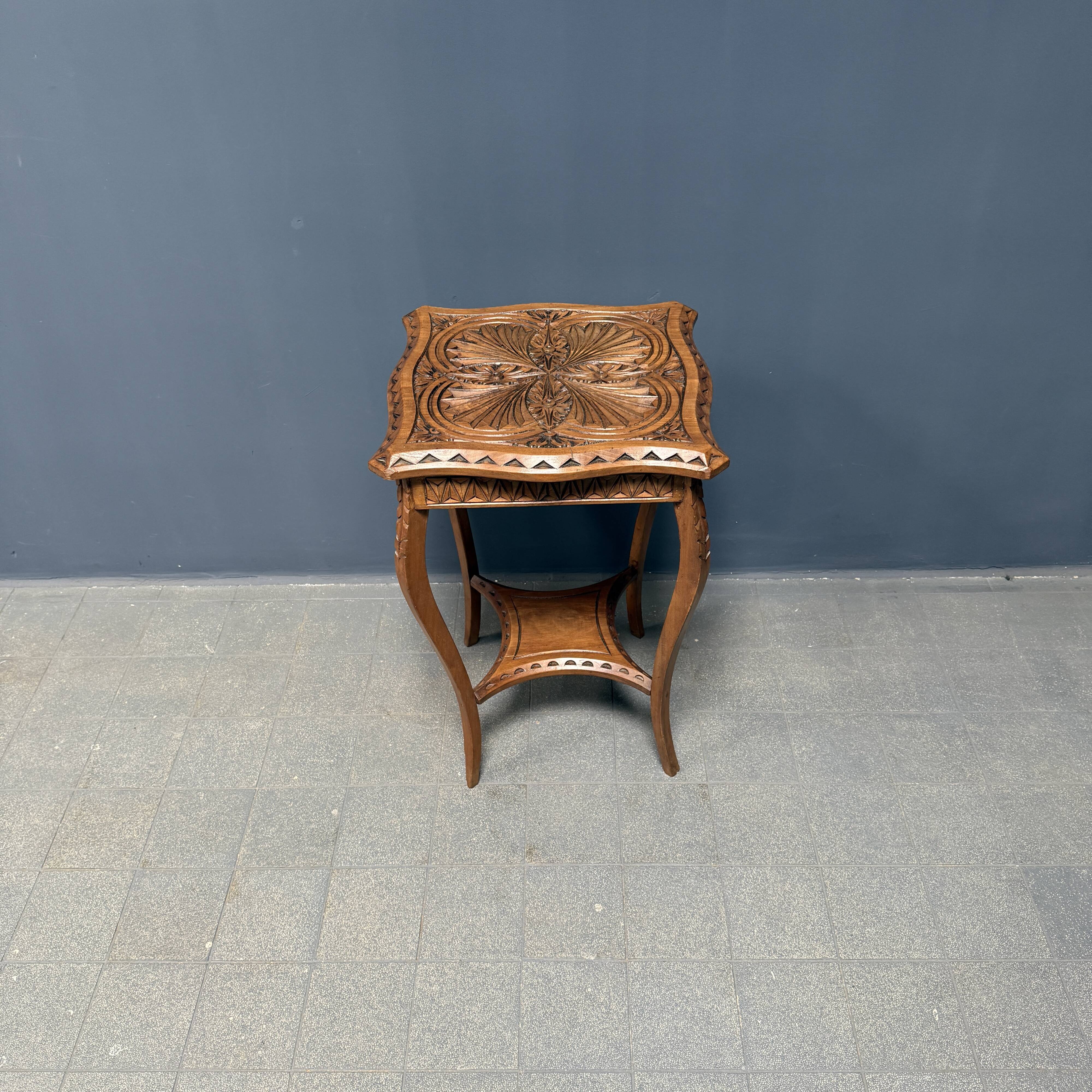 Graceful antique carved wooden side table
