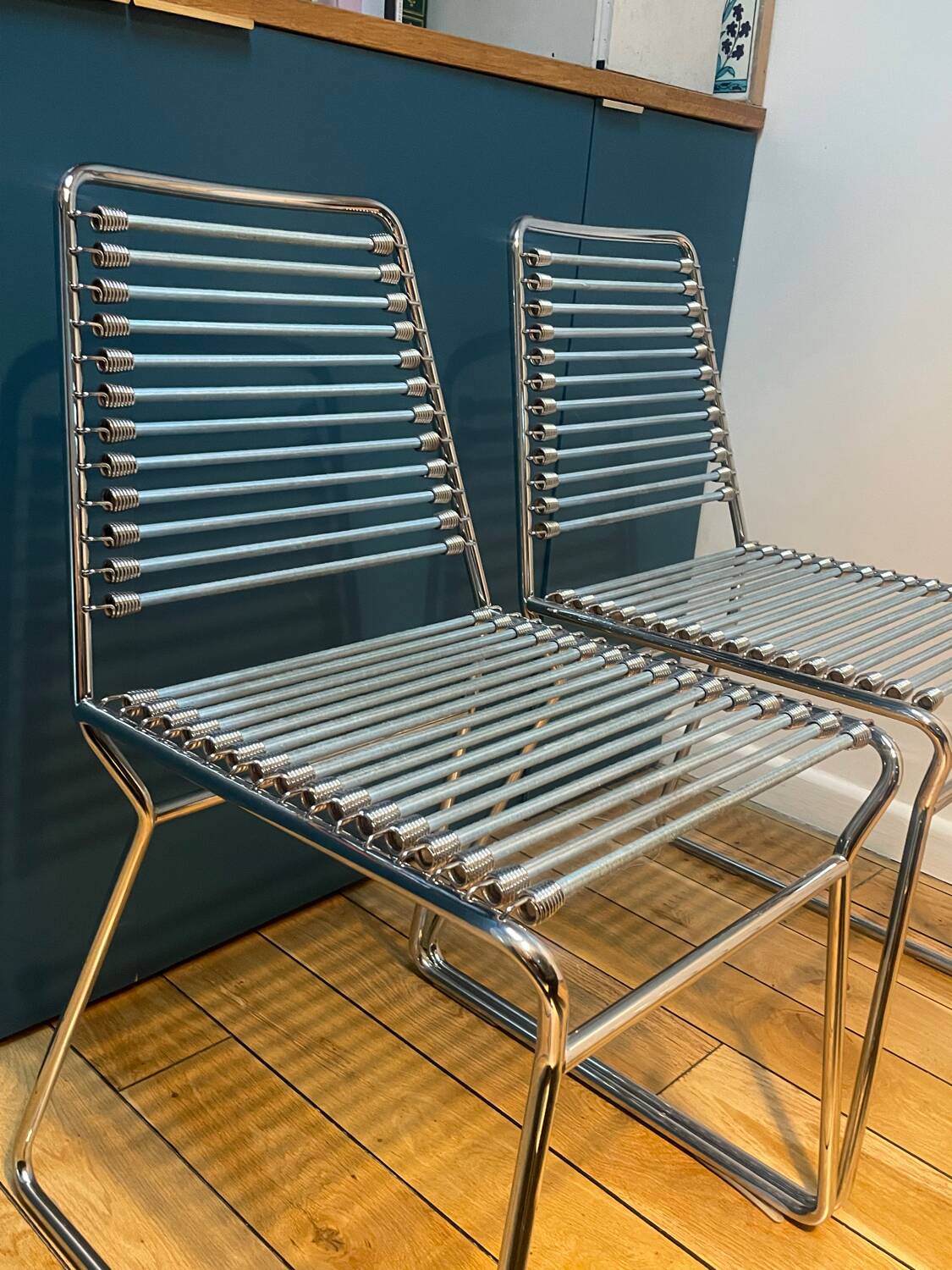 2 metal chairs with bungee cords
