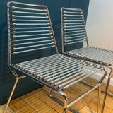 2 metal chairs with bungee cords