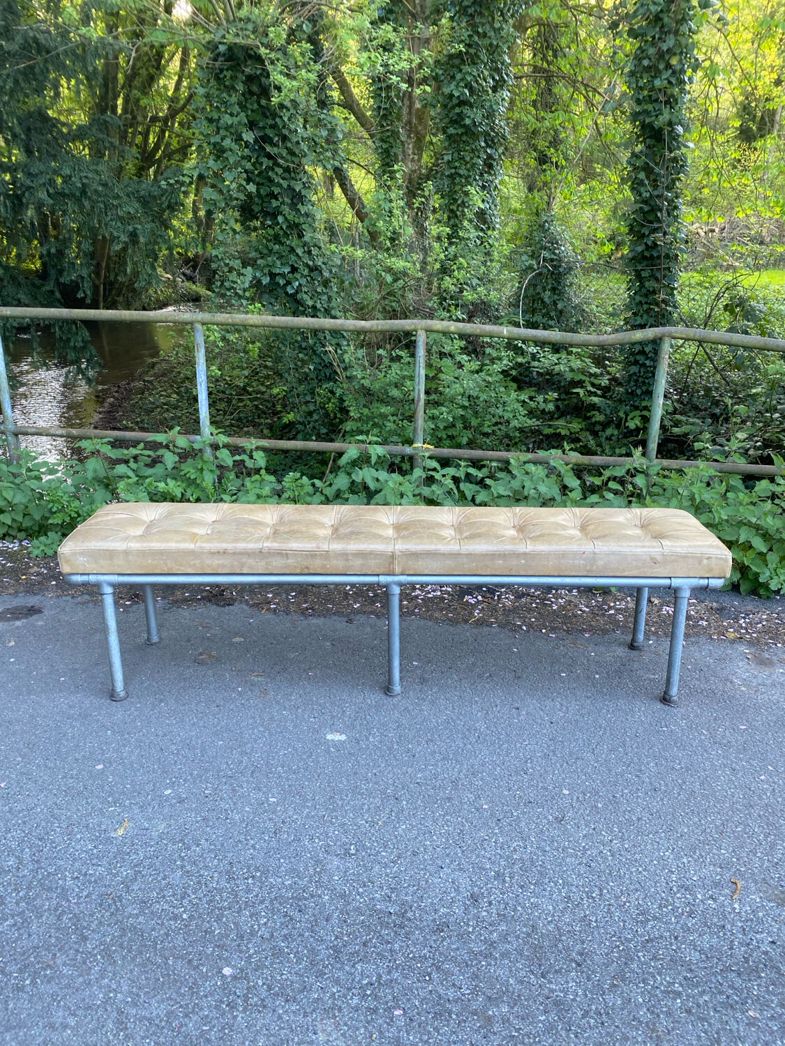 Vintage Italian industrial bench in leather and metal.