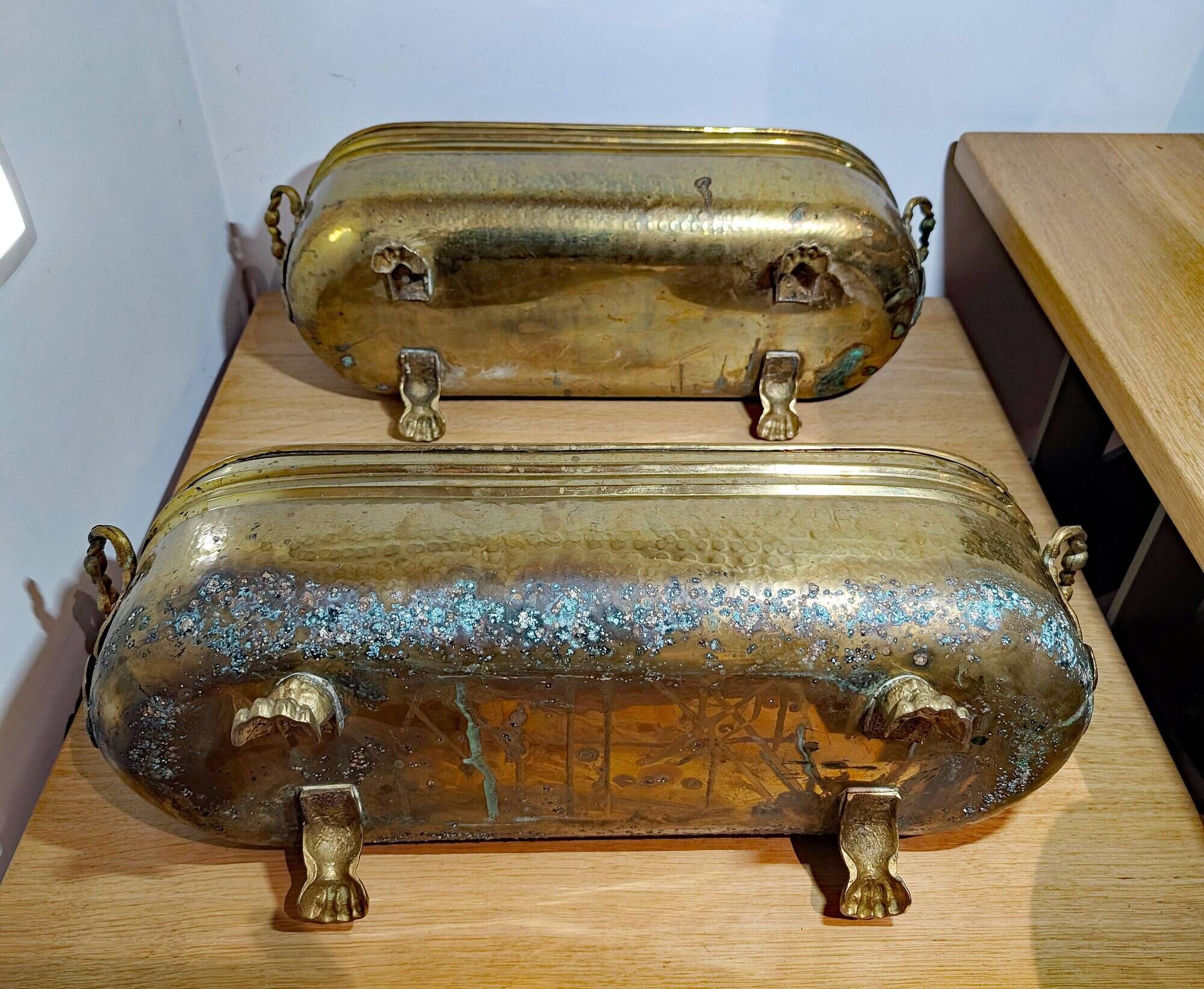 Pair of large antique planters with lion's paw feet.