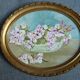 Pair of stucco frames and oil bouquets