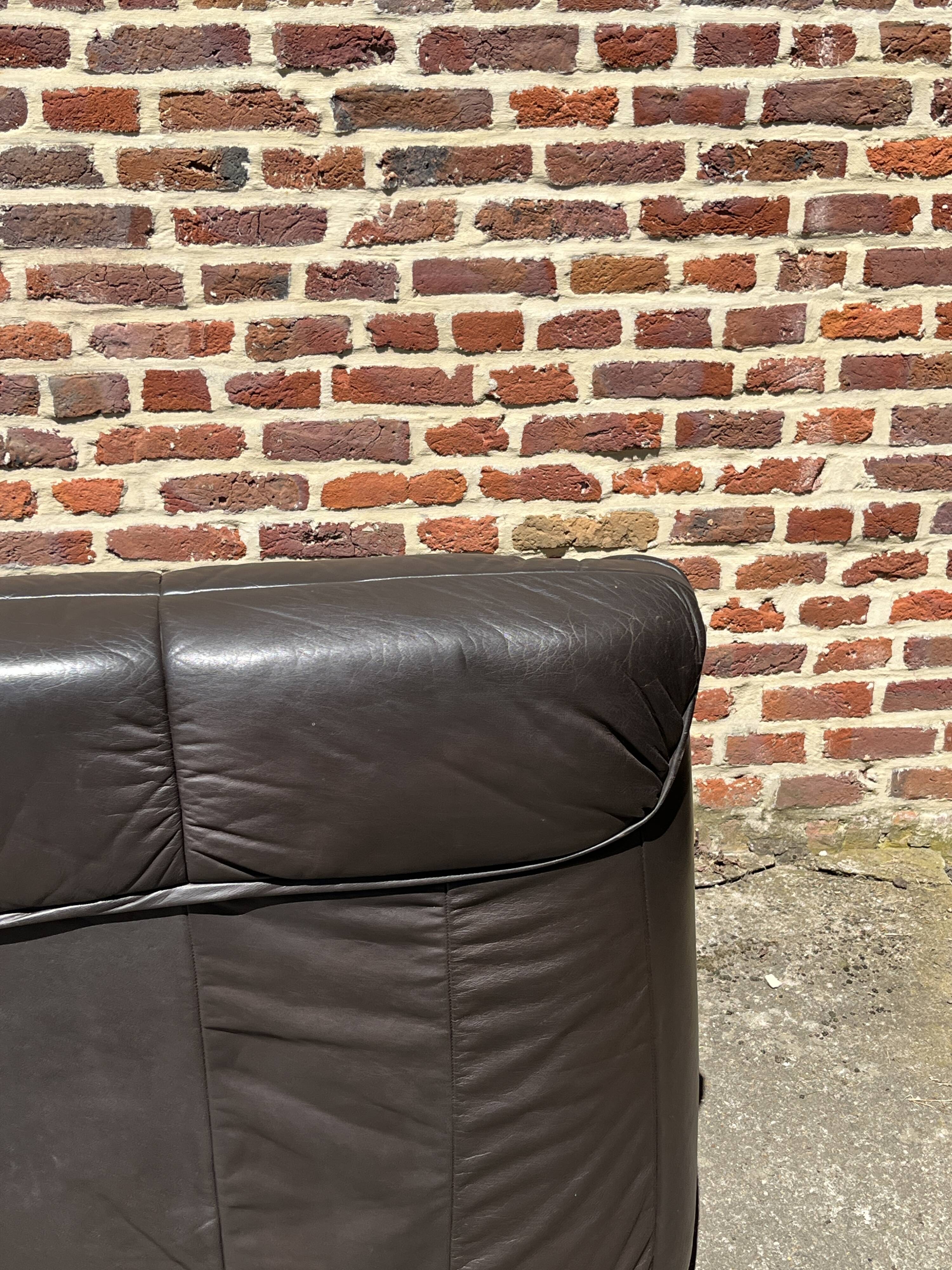 Pair of patinated leather club armchairs