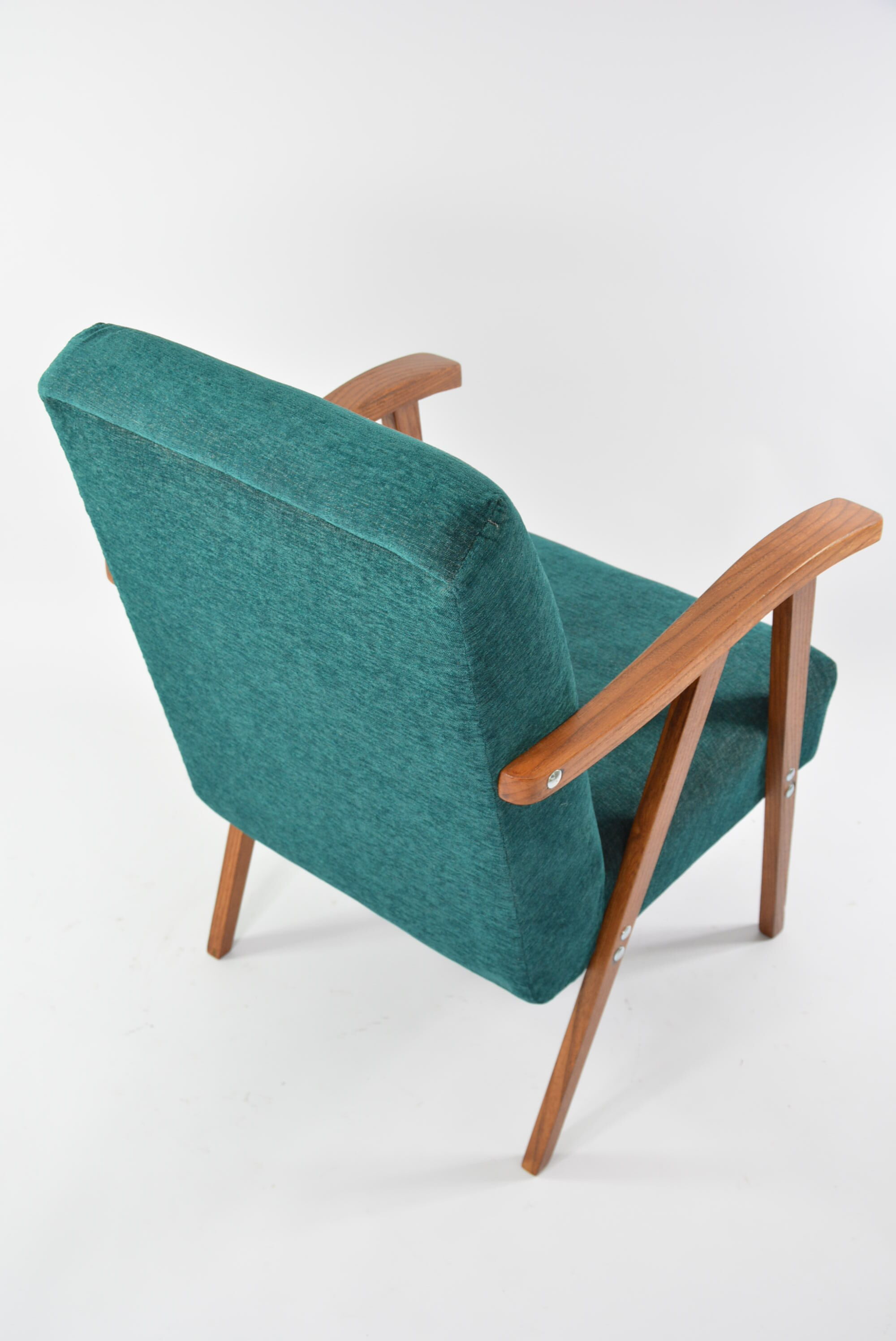 Green curved armchair