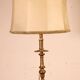 bronze candlestick from the 17th century converted into a lamp with its lampshade