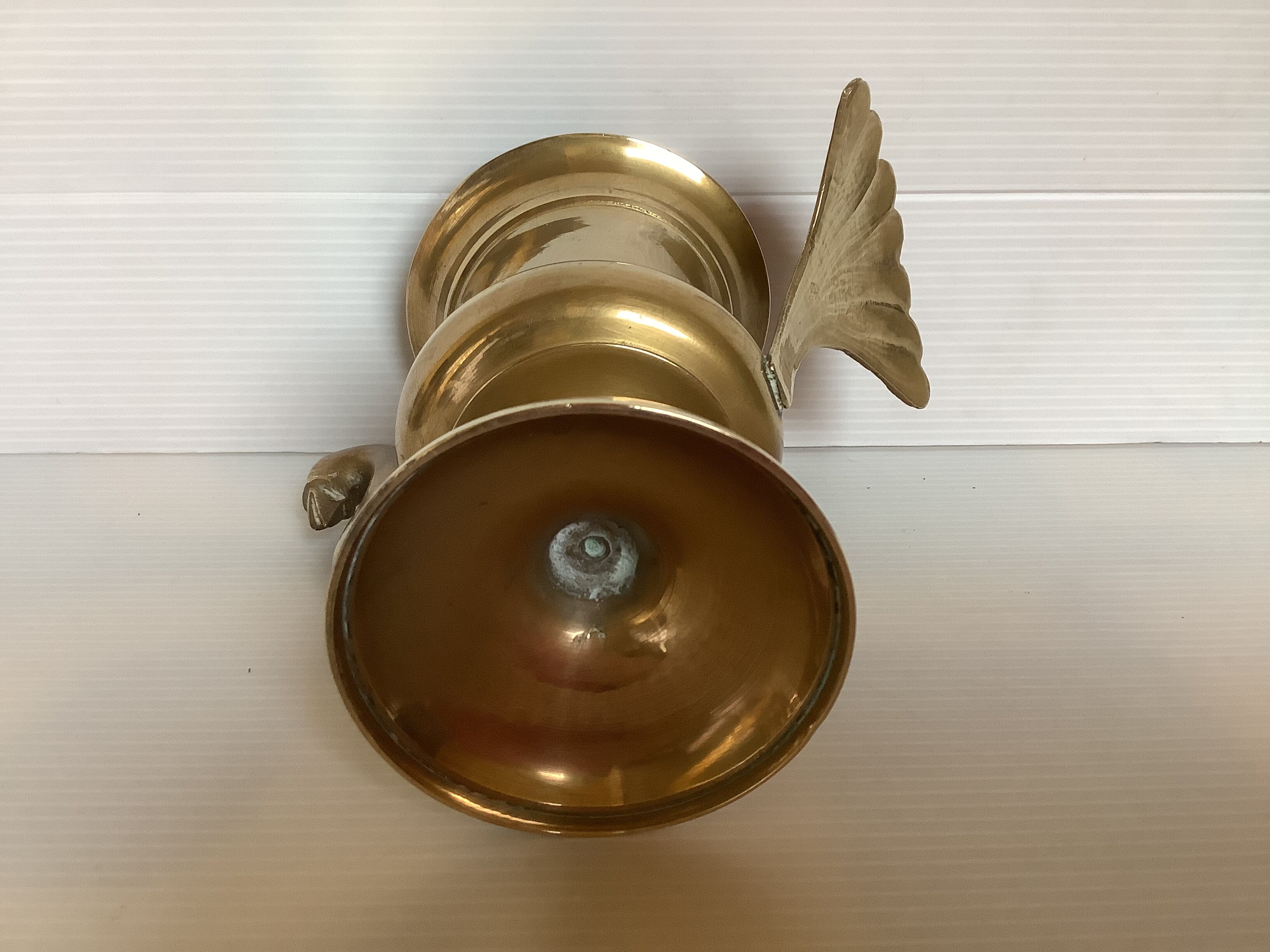 Empty brass bird pocket