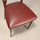 Set of six 1950s chairs with burgundy seats.