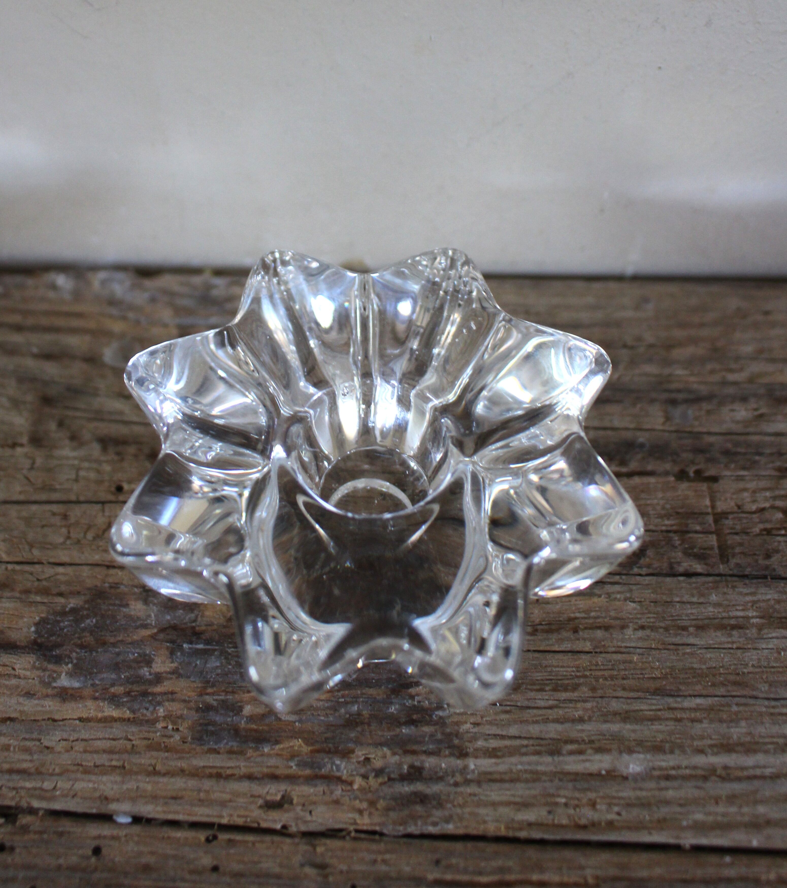 A vintage star flower glass candlestick.