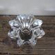 A vintage star flower glass candlestick.