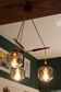 Scandinavian chandelier "Cascade" from the 1960s in brass, teak, and smoked glass.