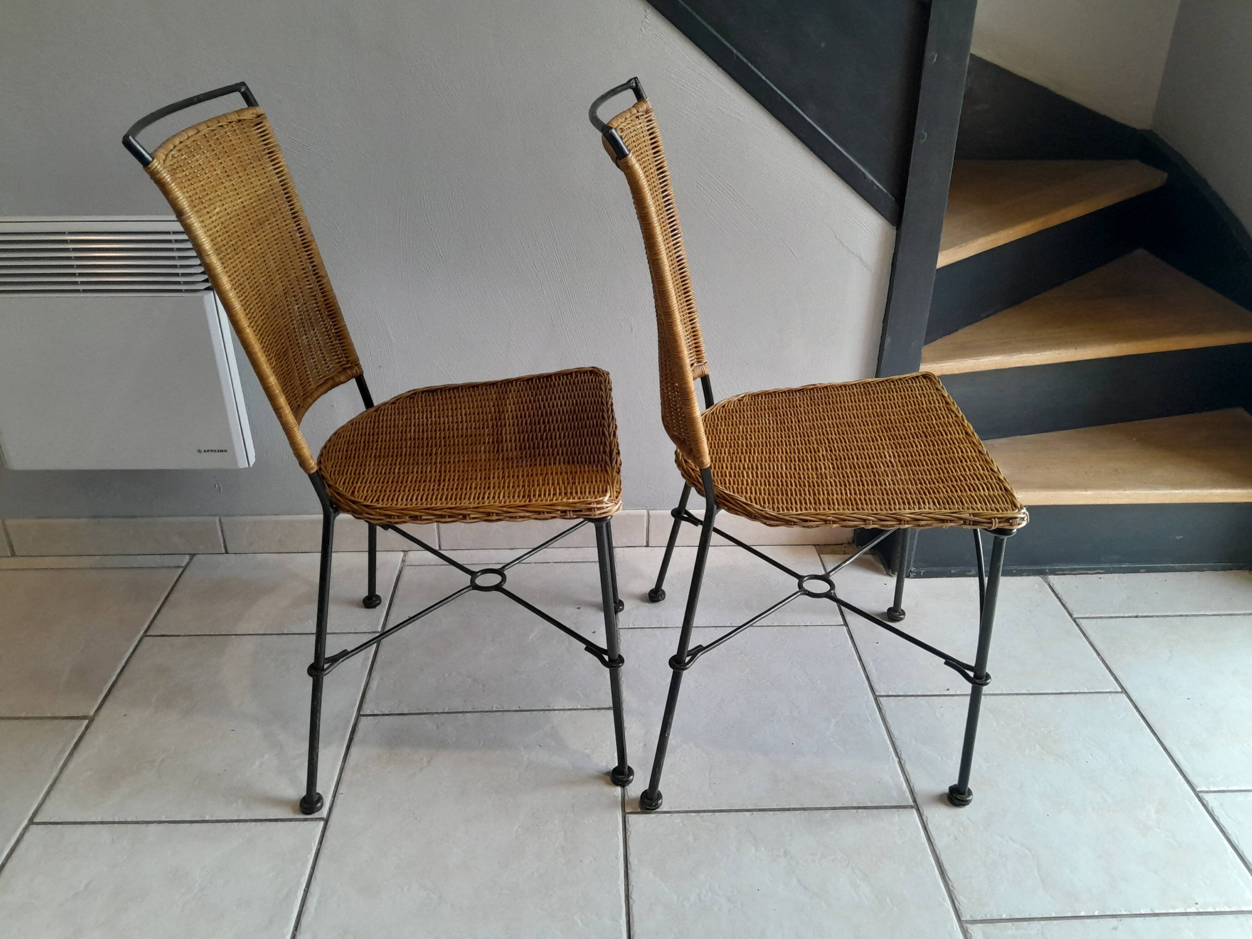 Pair of vintage wrought iron and rattan chairs