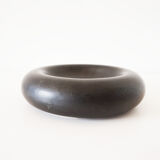 Empty round pocket in black ceramic