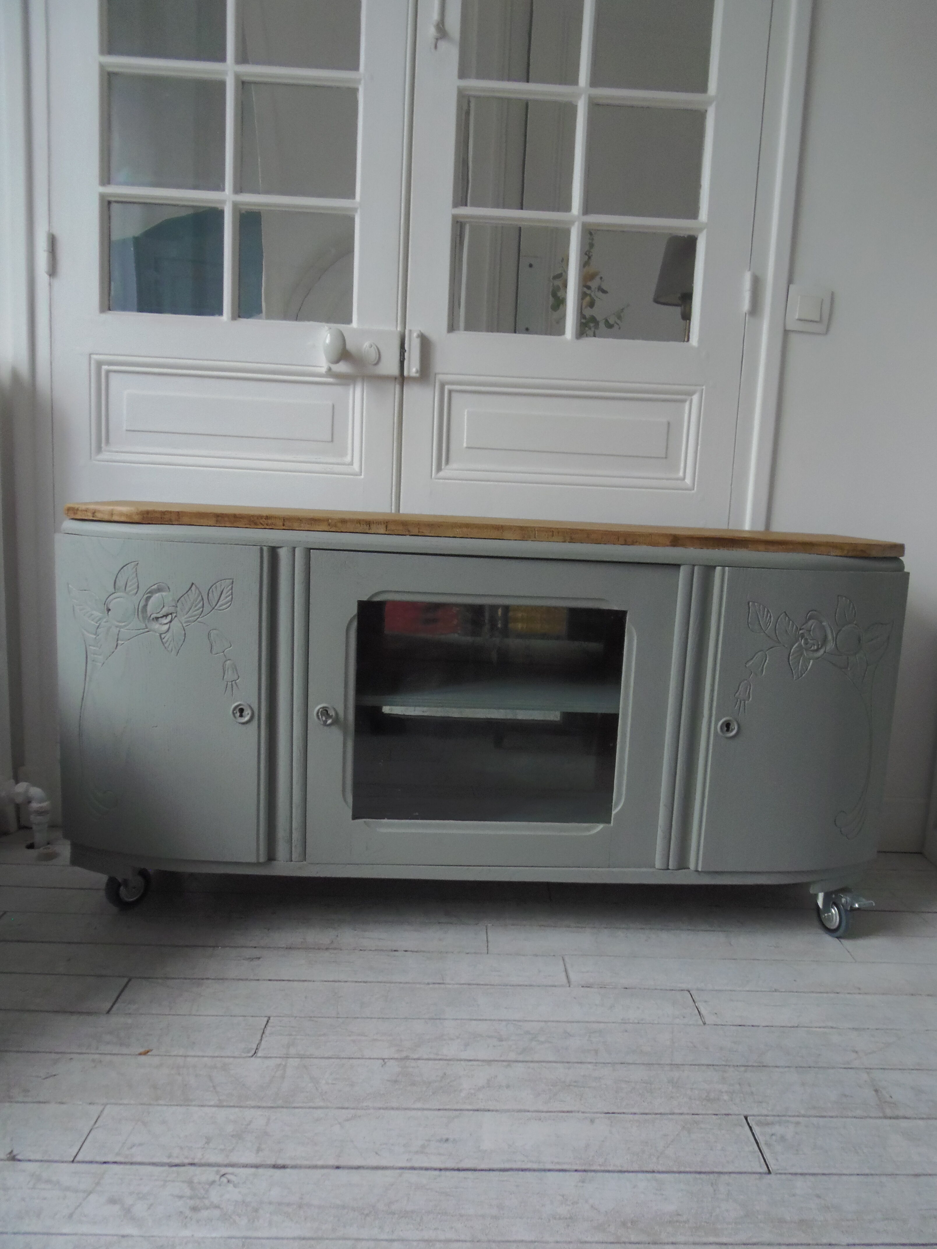 Art Deco furniture revisited in gray green and placed on wheels.
