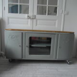 Art Deco furniture revisited in gray green and placed on wheels.