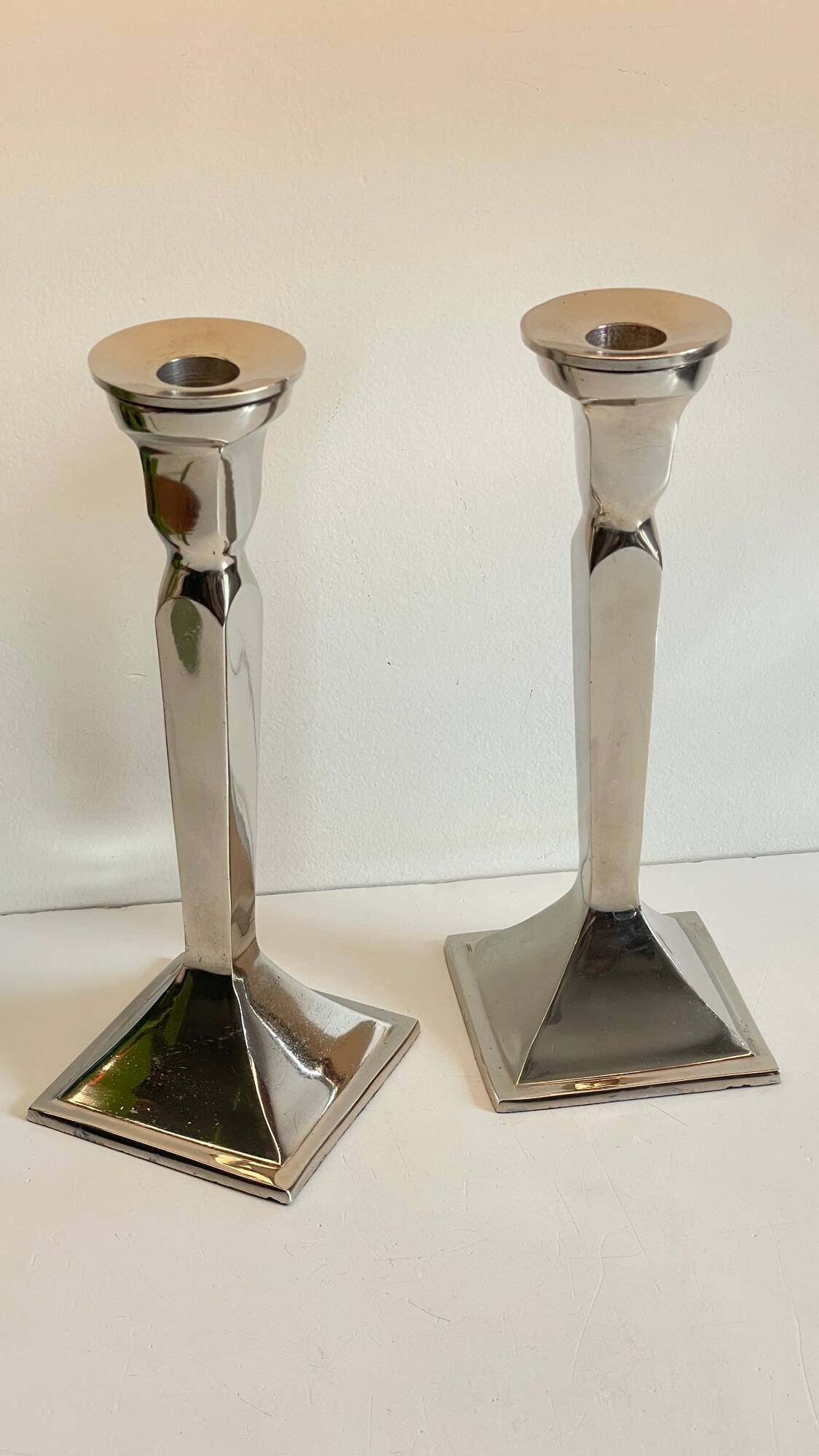Pair of vintage cast aluminum candlesticks