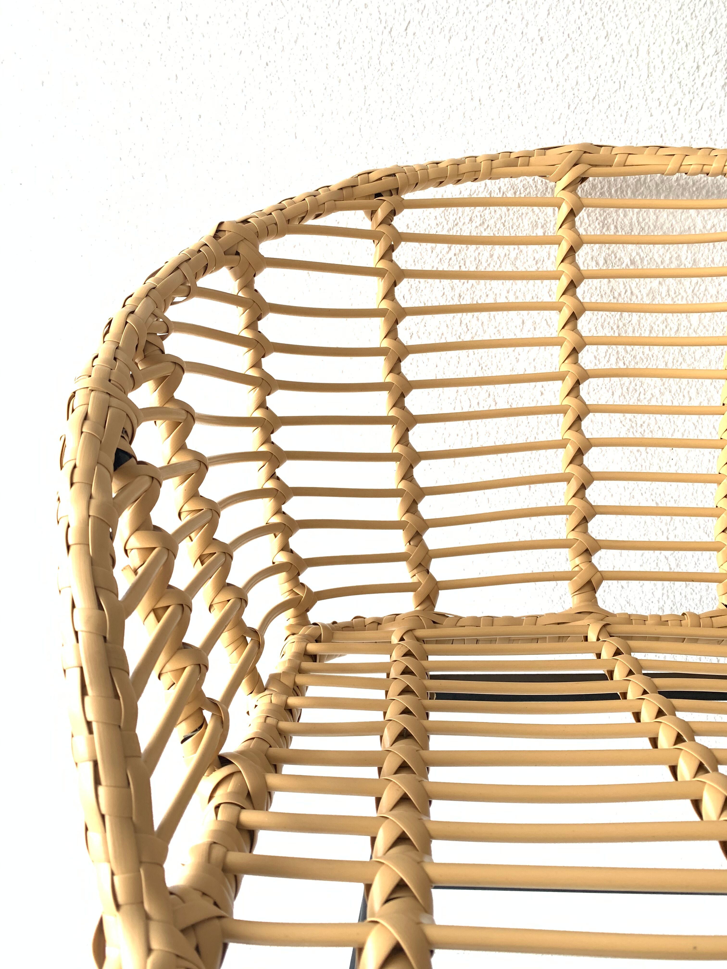 Natural coloured rattan resin armchair