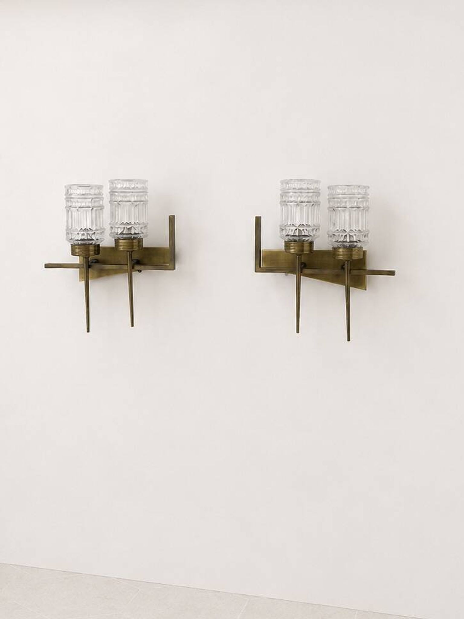 Pair of vintage brass and glass wall lights, France, 1950.