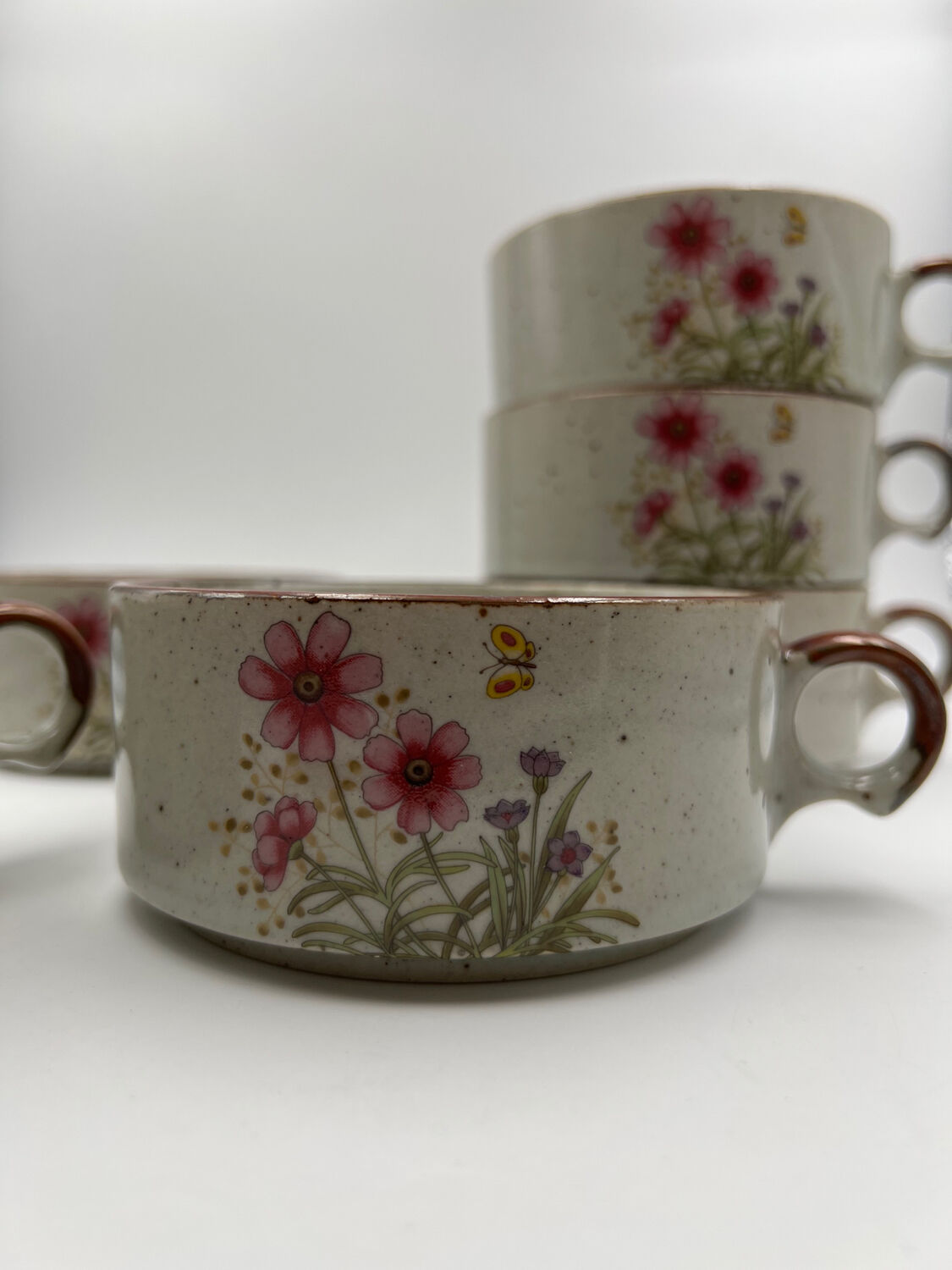Six ceramic floral cups