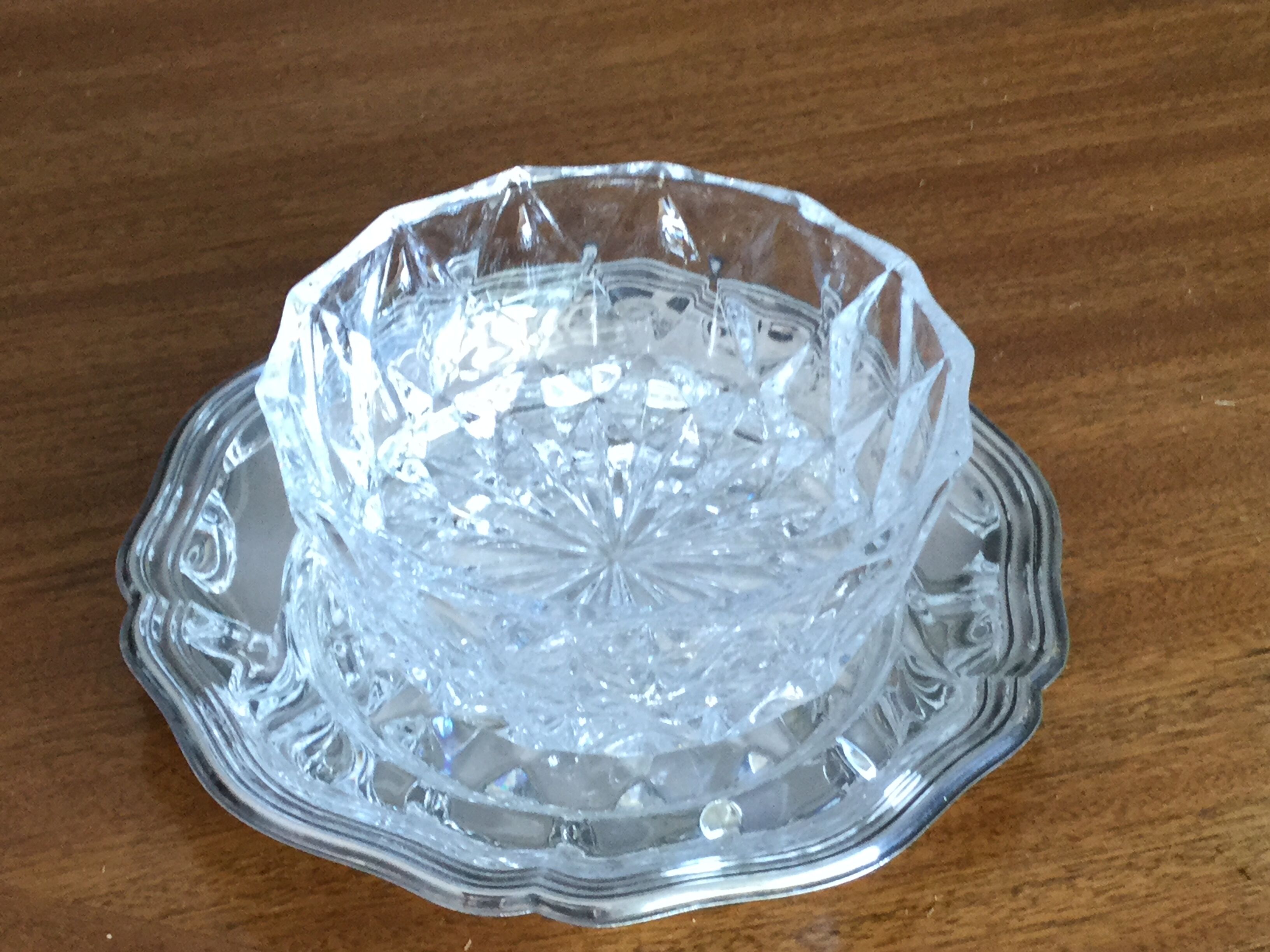 Crystal ravier on silver metal plate