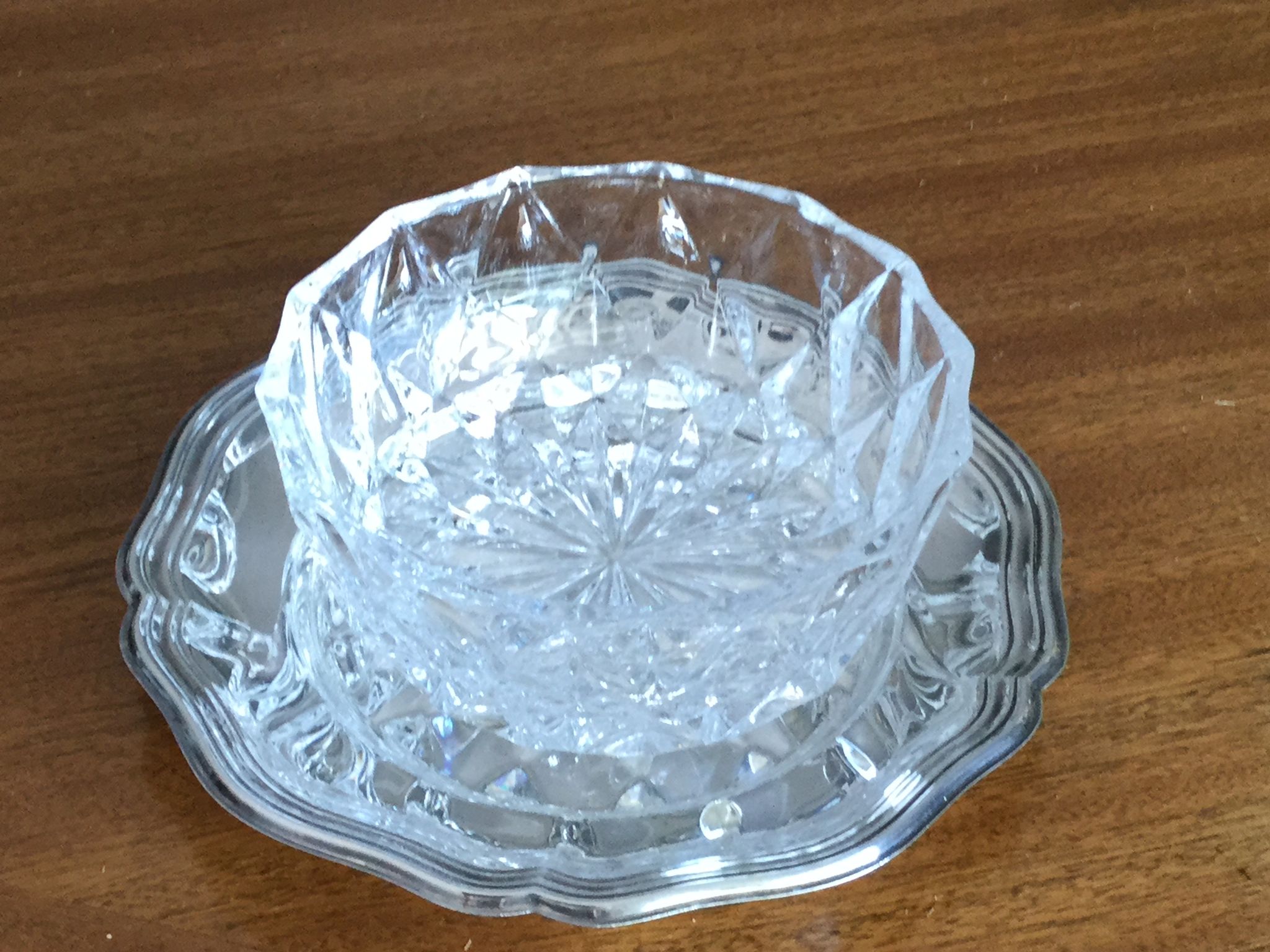 Crystal ravier on silver metal plate