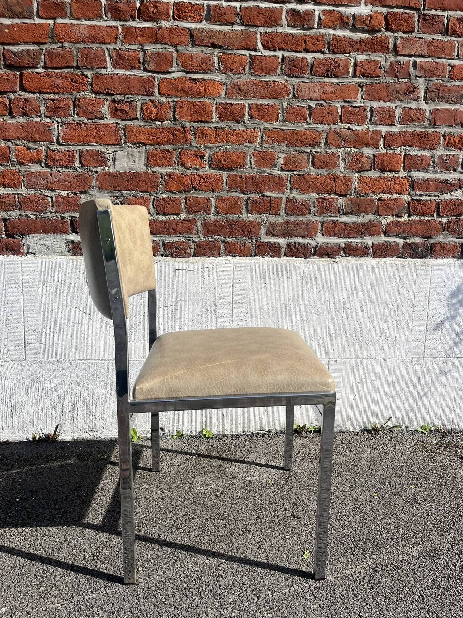 Set of 4 vintage chairs in chrome and faux leather.