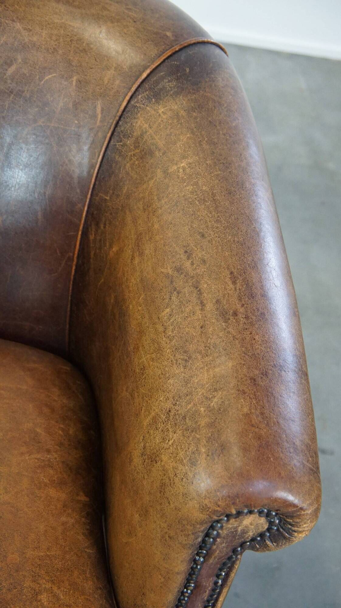 Characterful sheepskin leather club armchair with a luxurious, rustic appearance