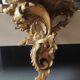 Small Italian/Baroque wall-mounted console. In gilded wood.