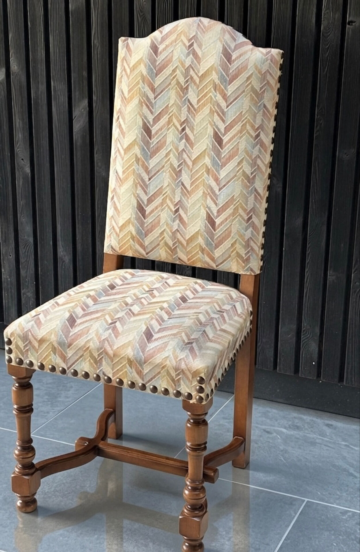 Restored and reupholstered antique chair with character