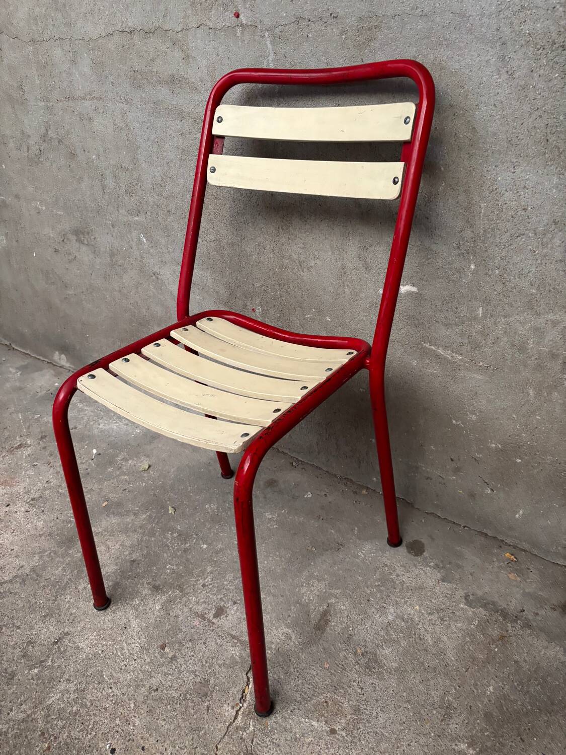 Red and white Tolix chair