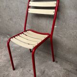 Red and white Tolix chair