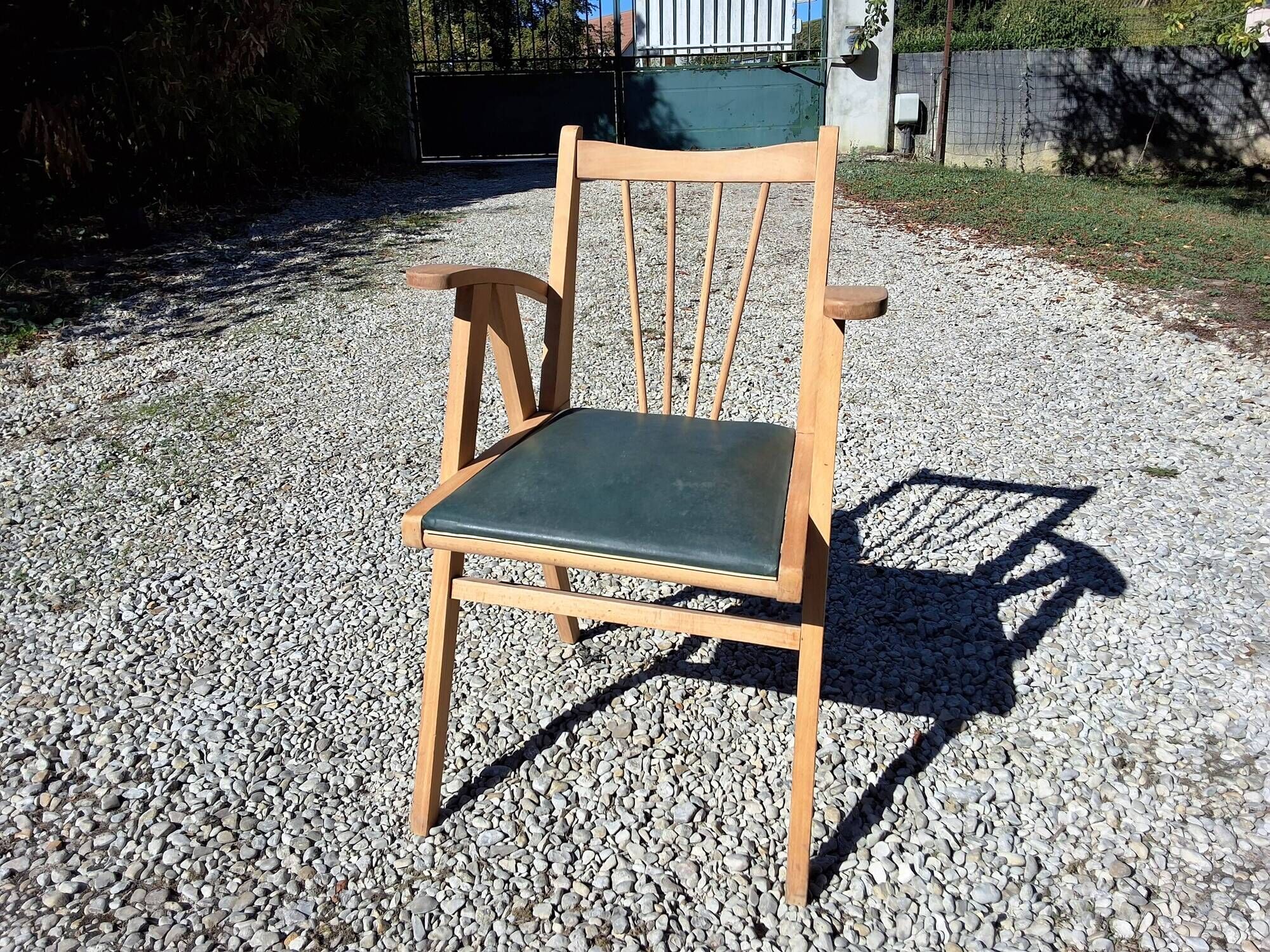 Compass leg armchair