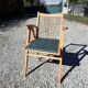 Compass leg armchair