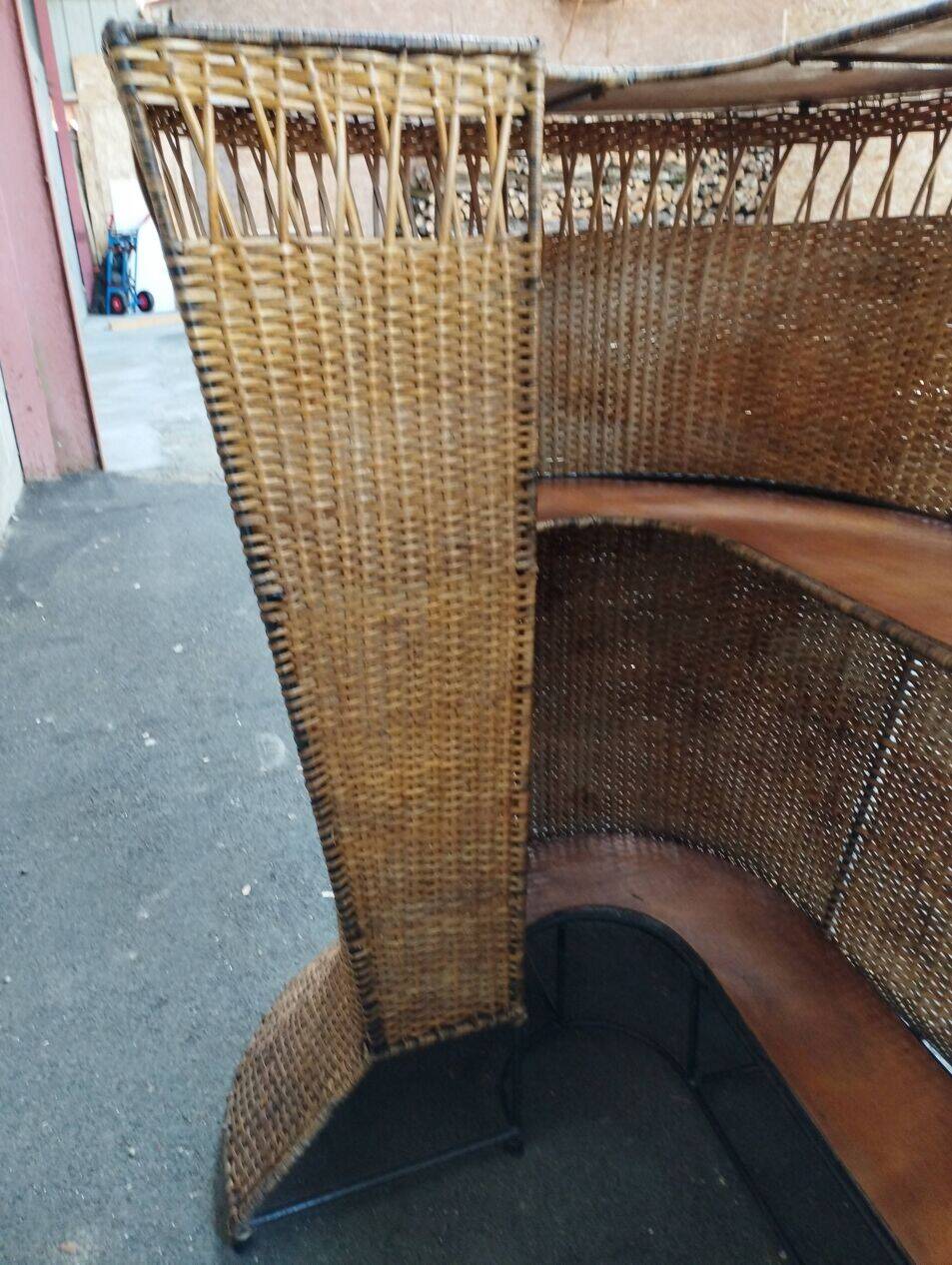 Vintage rattan and metal bar and its stools.