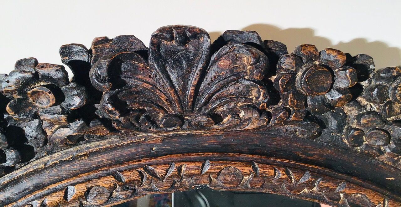 Oval mirror on an 18th century frame