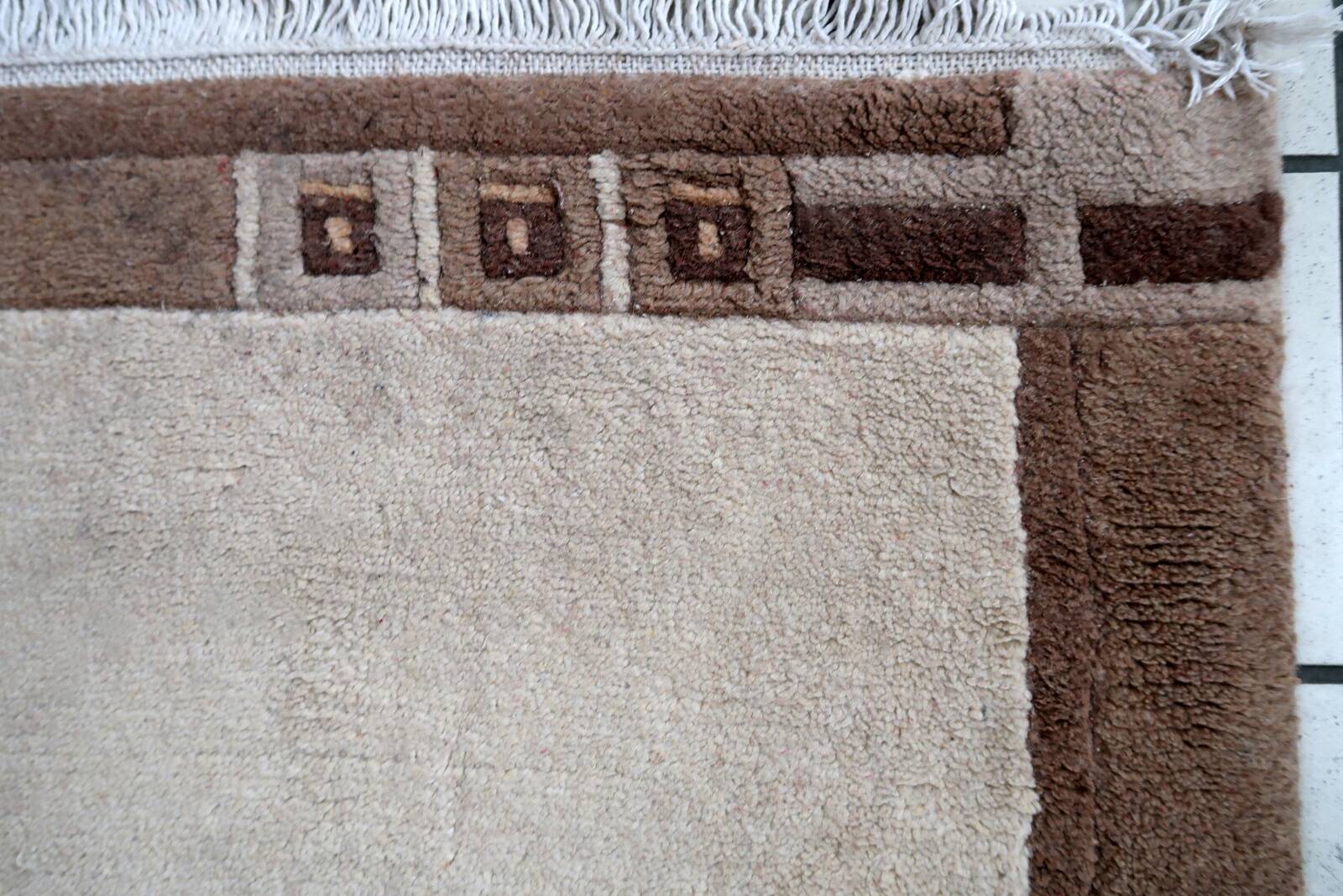 Tapis vintage tibétain Khaden fait main en laine – 64 x 124 cm  Années 1970