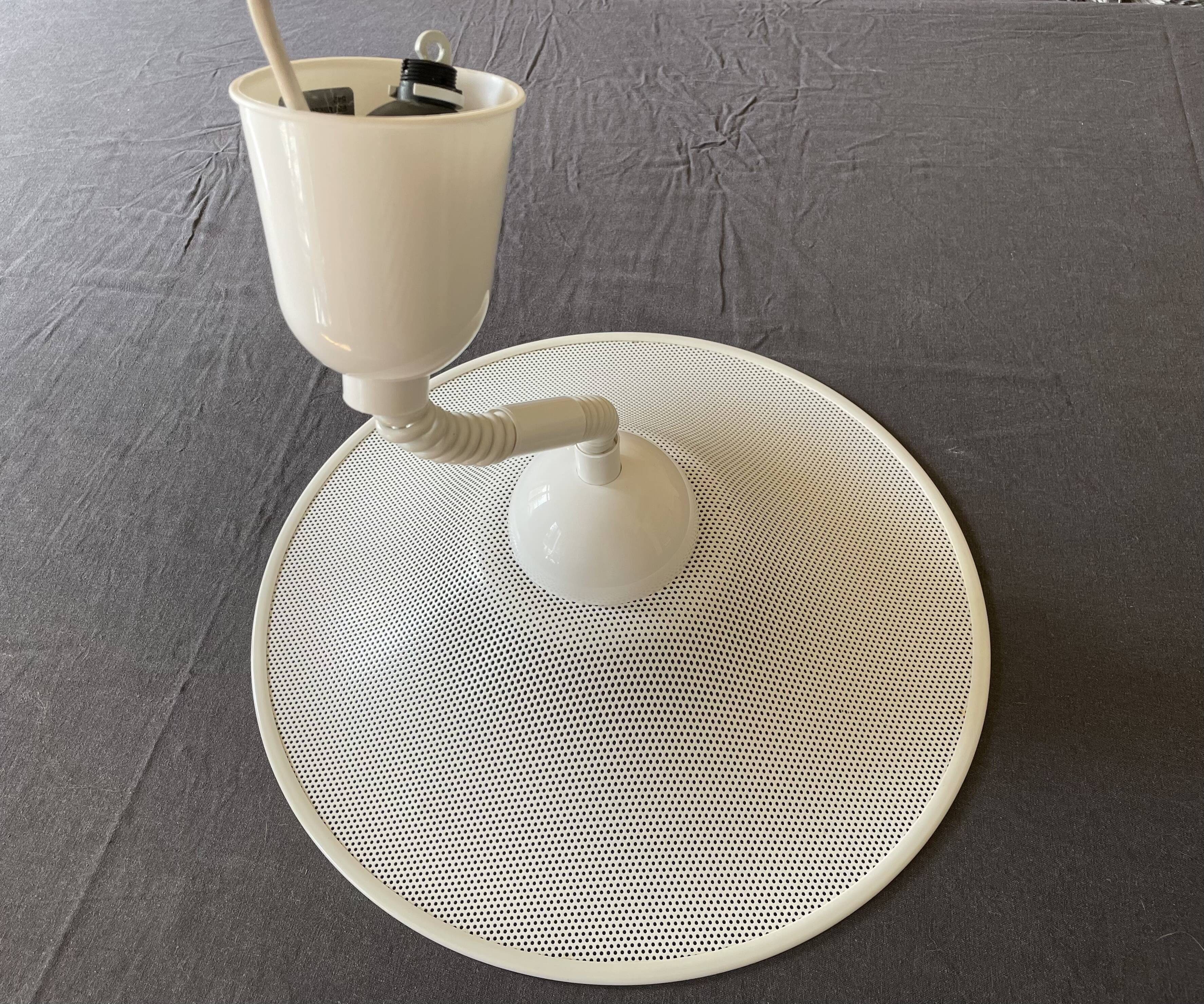 Suspension of the 80s in perforated white metal