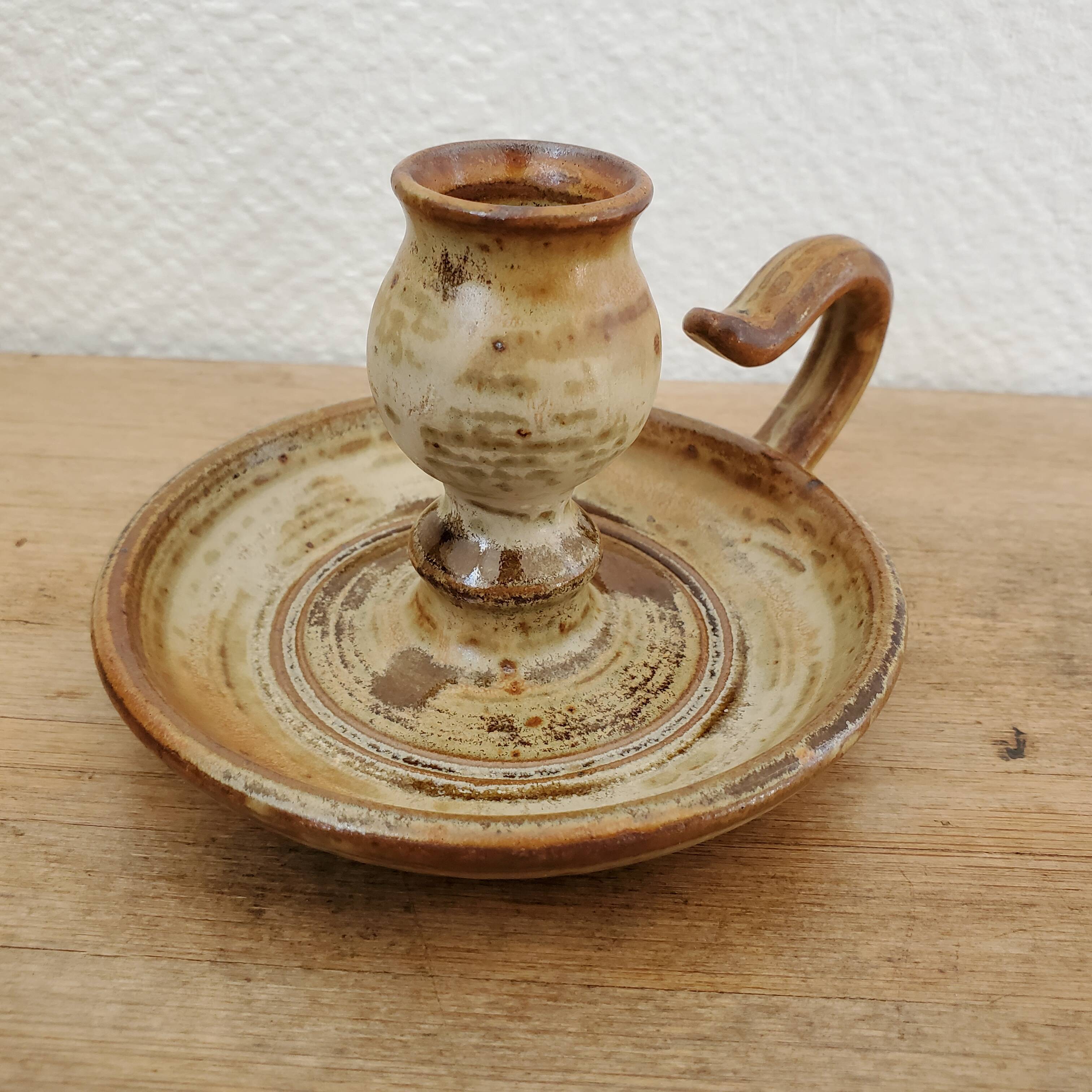 Sandstone candle holder called cellar rat